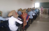 Polêmica contra cola: Fotos de alunos fazendo prova com caixa de papelão na cabeça para não 'colar' causam polêmica